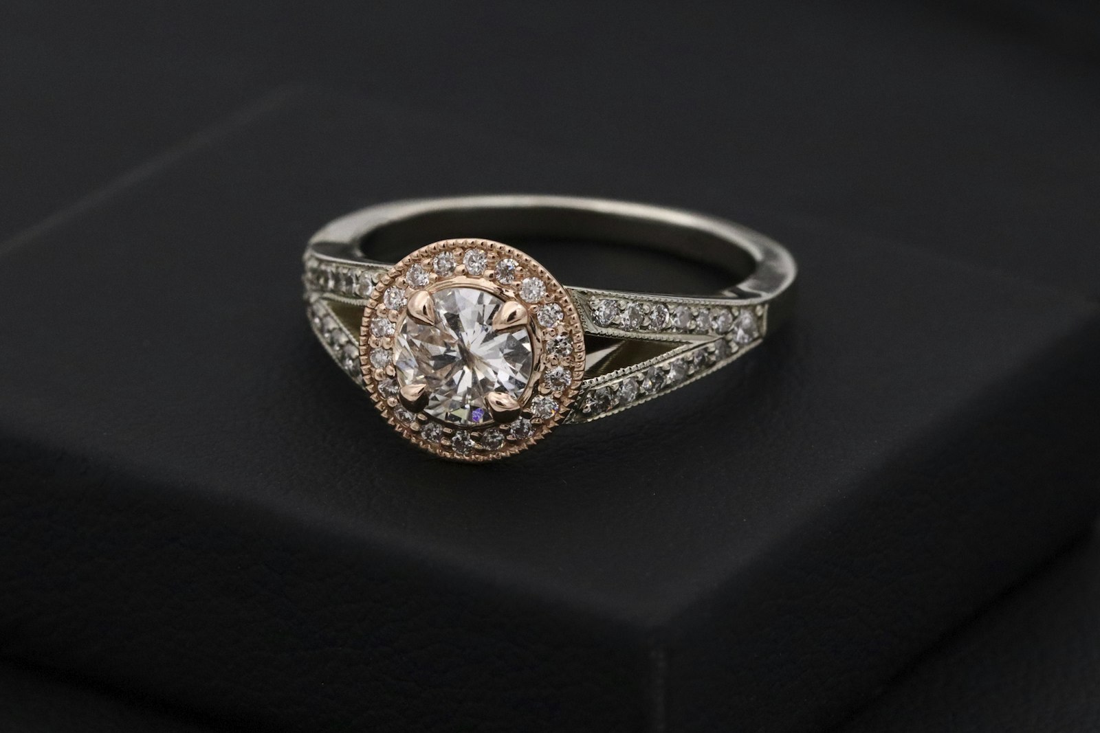 Diamond ring resting on a black box