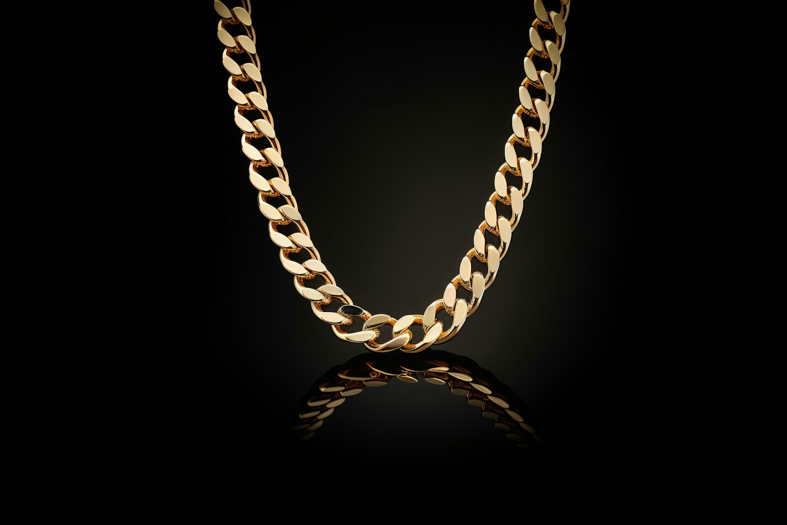 Gold chain on a black background