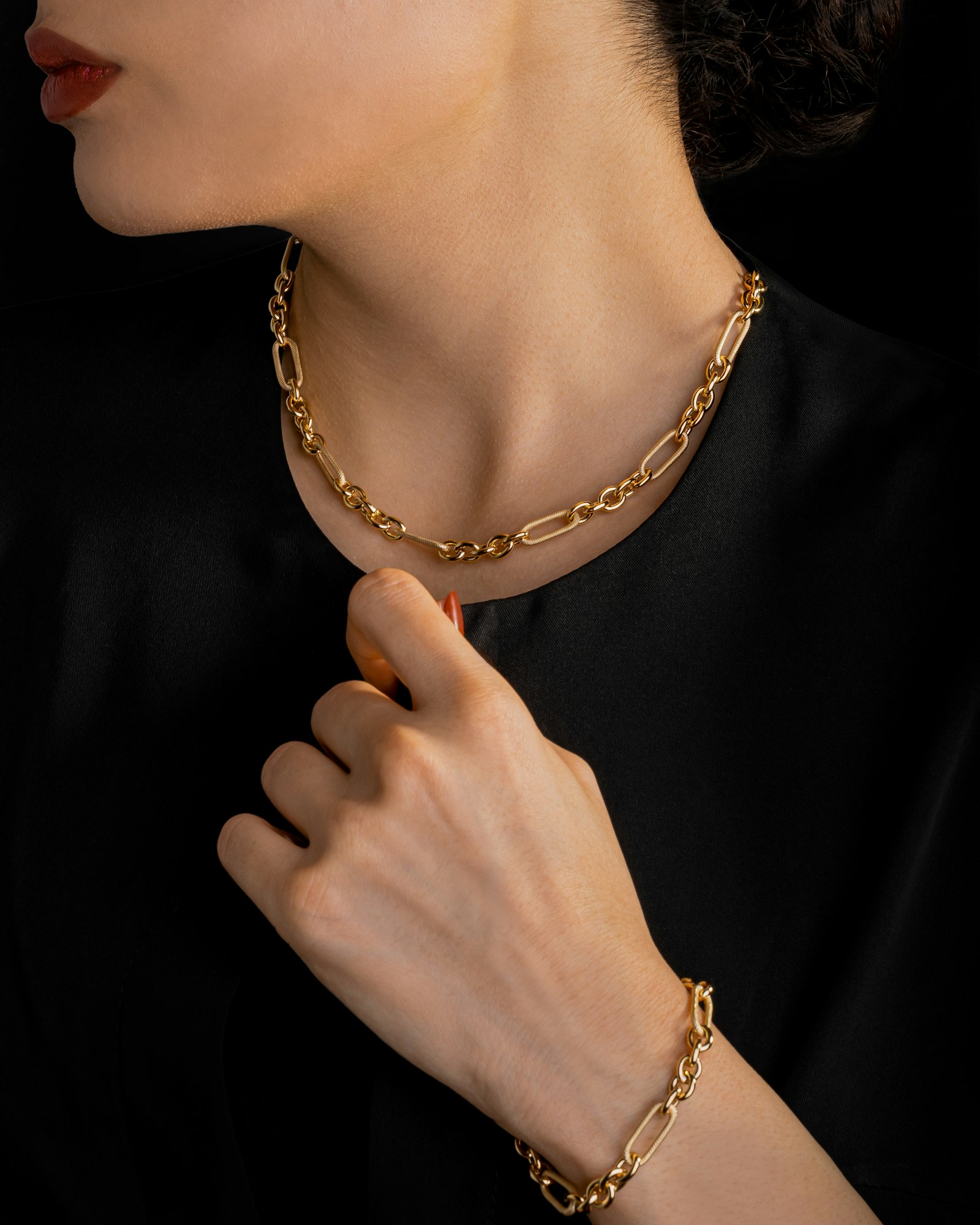 Gold chain bracelet worn on the wrist